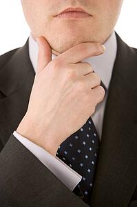 Businessman Holding His Chin 