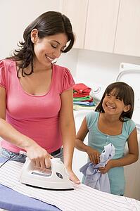 Mother And Daughter Ironing 