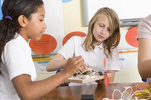 Students in class with electronic projects
