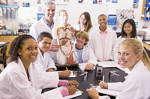 Students in biology class with teacher