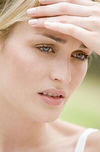 Head shot of woman scowling