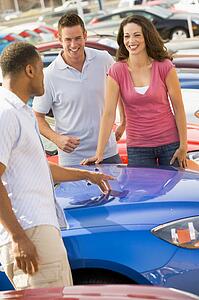 Young couple shopping for a new car
