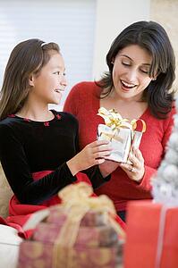 Girl Surprising Her Mother With Christmas Gift