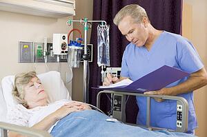 Doctor Making Notes About Patient