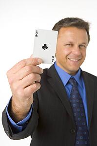 Businessman Holding The Ace Of Clubs
