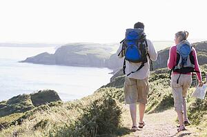 Couple on cliffside outdoors walking