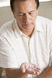 Man Taking Pills