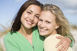 Two young women posing outdoors