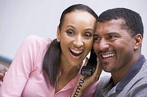 Couple receiving a good news phone call from clinic