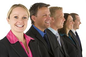 Group Of Business People In A Line Smiling