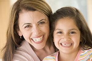 Woman and young girl smiling