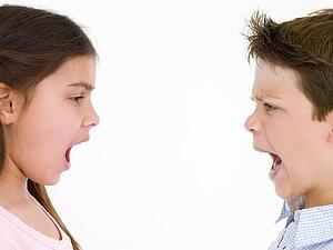 Brother and sister looking at each other shouting