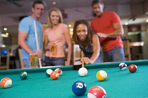 Friends playing pool