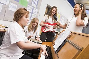 Student musicians practising in classroom