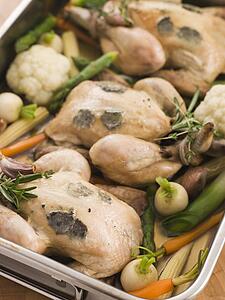 Roasting Tray of Black Truffled Poussins with Baby Spring Vegetables
