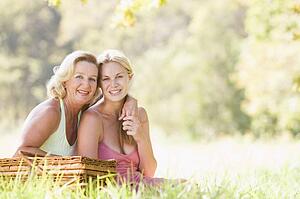 Mother with adult daughter on picnic