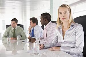 Four businesspeople in a boardroom