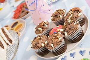 Birthday party table setting with food