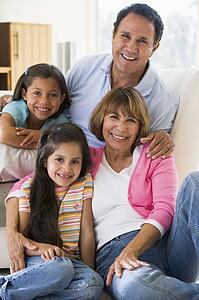 Grandparents posing with grandchildren.