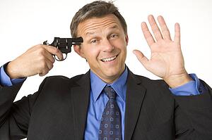 Businessman Holding Gun To His Head While Smiling And Waving 