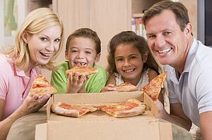 Family Eating Pizza Together 