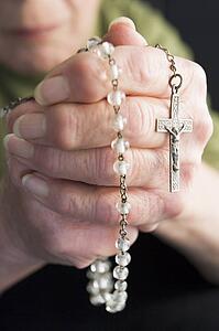 Close-Up Of Elderly Person Holding Rosary Beads