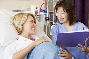 Pregnant Woman Talking To Doctor