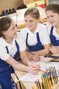 Female students learning woodworking