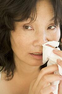 Woman Blowing Her Nose