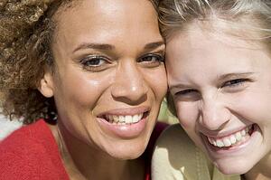 Two young women posing outdoors