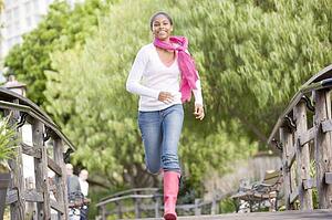 Teenage Girl Jogging In Park 