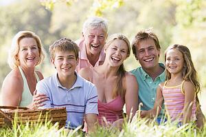 Family at a picnic smiling