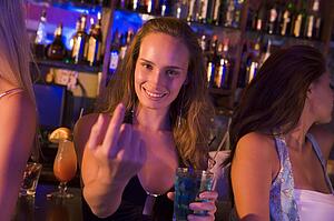 Young woman in a bar with friends