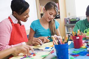 Teacher and student in art class (selective focus)