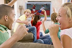 Teenagers Hanging Out In Front Of Television 