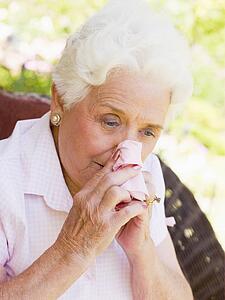 Woman Blowing Her Nose