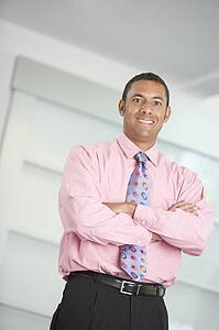 Businessman standing indoors smiling