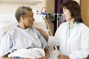 Doctor Talking To Senior Woman