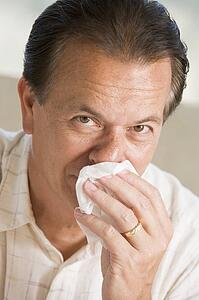 Man Blowing His Nose
