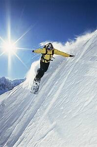 Snowboarder coming down hill