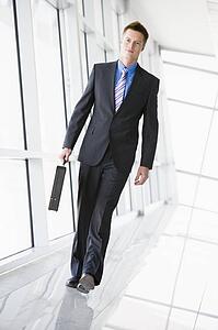 Businessman walking in corridor