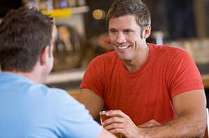 Two men having beer together