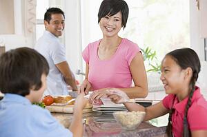 Family In The Kitchen Eating Breakfast