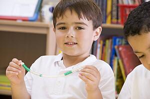 Student in math class with counting beads