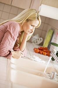 Woman At Kitchen Counter 
