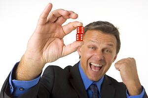 Businessman Holding Two Red Dice 
