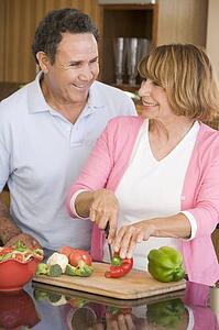 Husband And Wife Preparing meal, mealtime Together