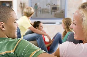 Teenagers Hanging Out In Front Of Television 