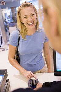 Woman paying for purchases with credit card