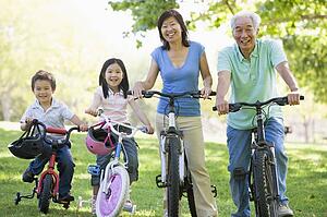 Grandparents bike riding with grandchildren.